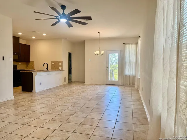 a view of a hallway with a kitchen