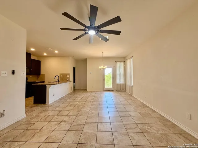 a view of a kitchen with a sink and a window