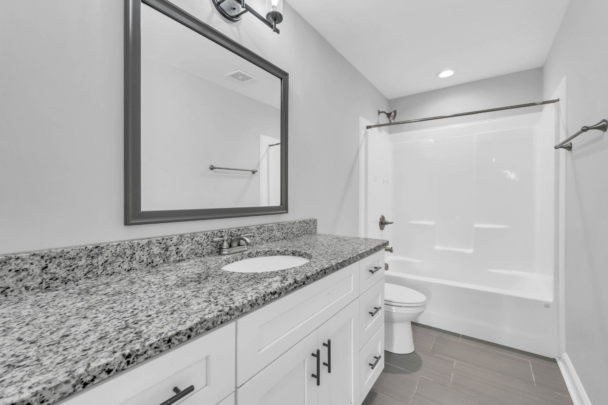 2320 Bearden Road Clarksville, TN 37043 - Photo 28 of 44 a bathroom with a granite countertop sink mirror vanity and toilet