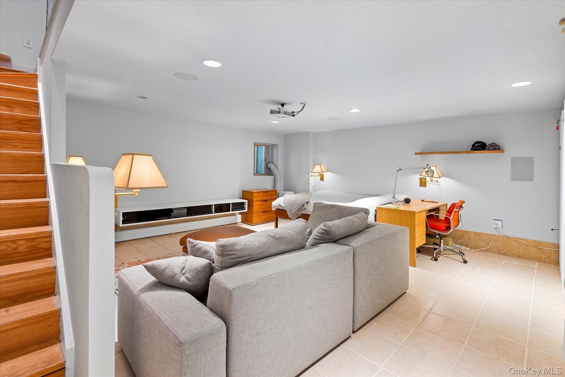 100-12 Shore Front Parkway, Unit 18A Queens, NY 11694 - Photo 24 of 37 a living room with furniture