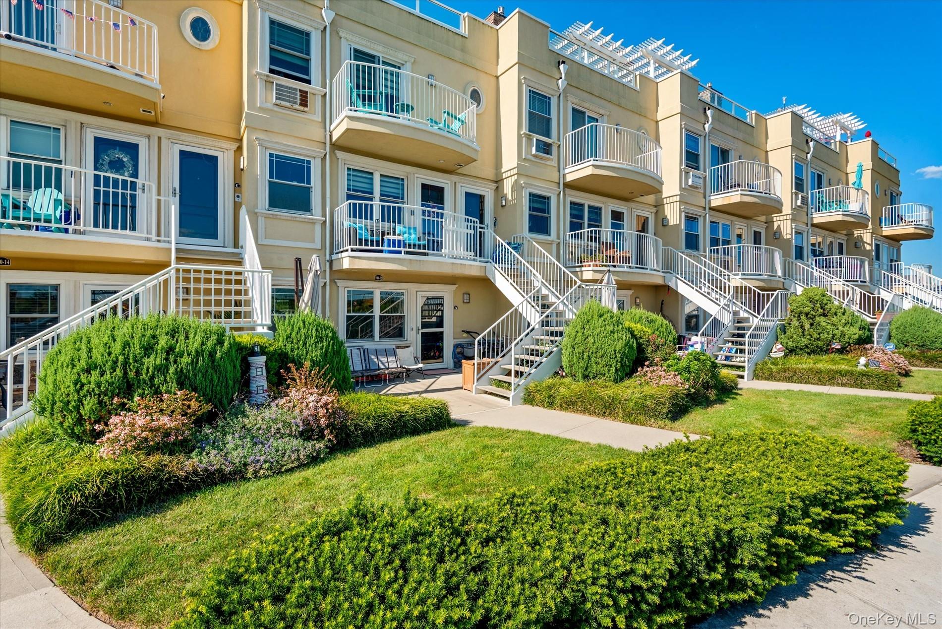 100-12 Shore Front Parkway, Unit 18A Queens, NY 11694 - Photo 4 of 37 a view of a building with a garden