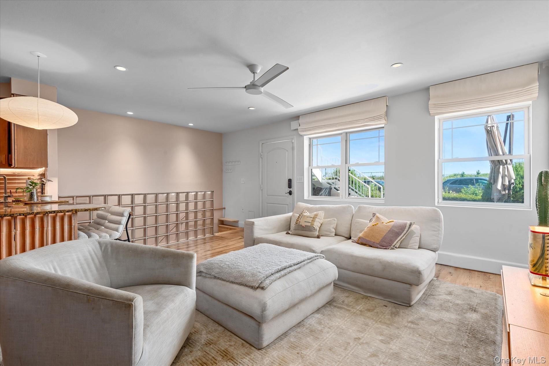 100-12 Shore Front Parkway, Unit 18A Queens, NY 11694 - Photo 8 of 37 a living room with furniture and a large window