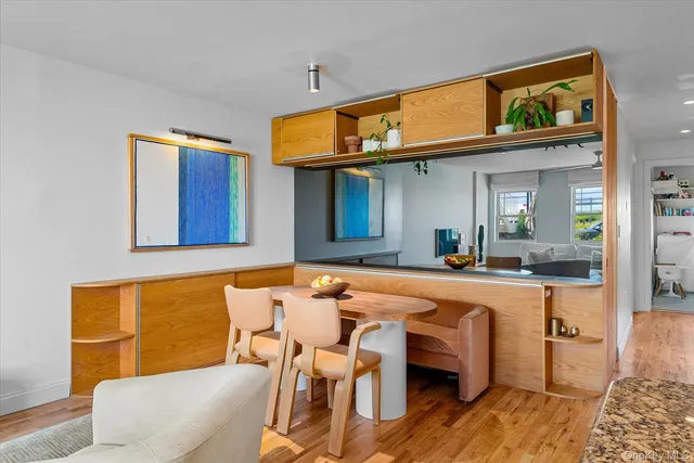 a dining room with a table and chairs