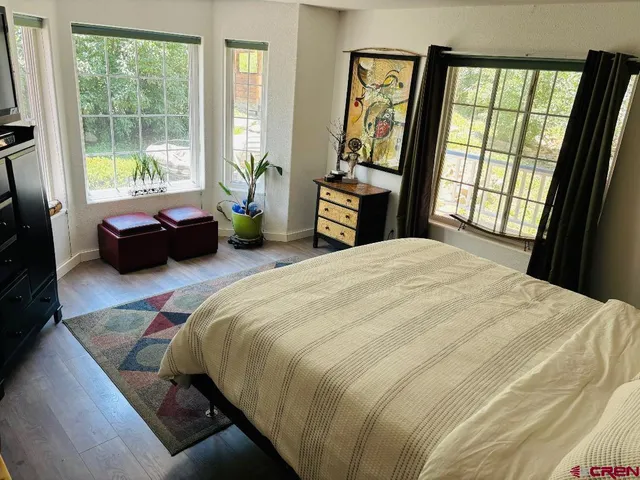 a bathroom with a shower a toilet and a sink