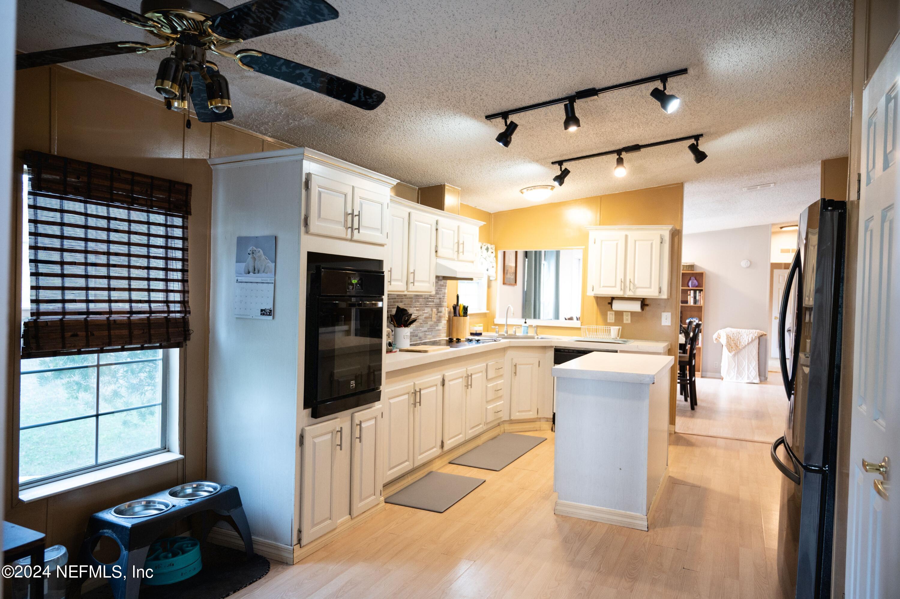 285 Dusty Road St. Augustine, FL 32095 - Photo 15 of 40 a large kitchen with cabinets
