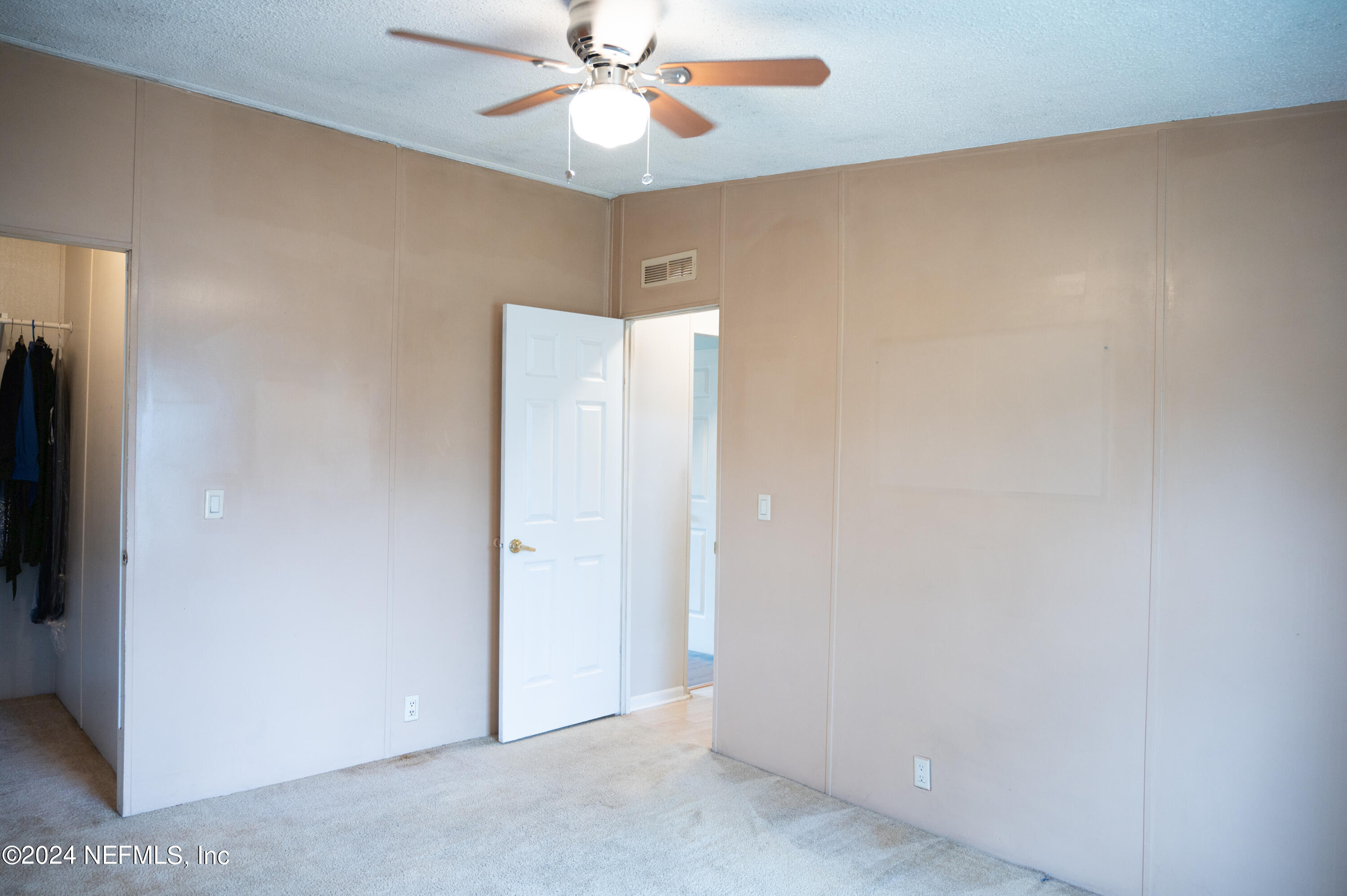 285 Dusty Road St. Augustine, FL 32095 - Photo 25 of 40 an empty room with a ceiling fan and a window