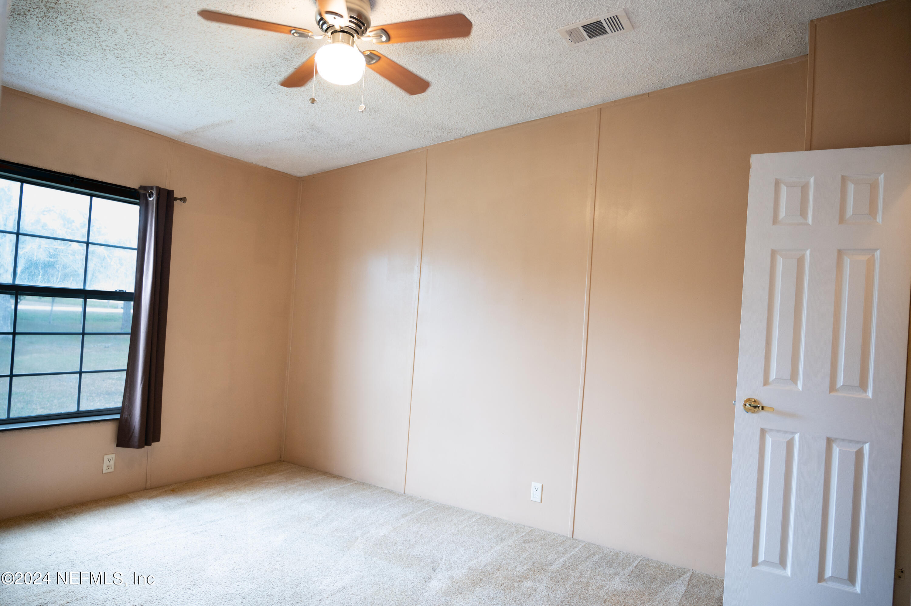 285 Dusty Road St. Augustine, FL 32095 - Photo 26 of 40 an empty room with windows and fan