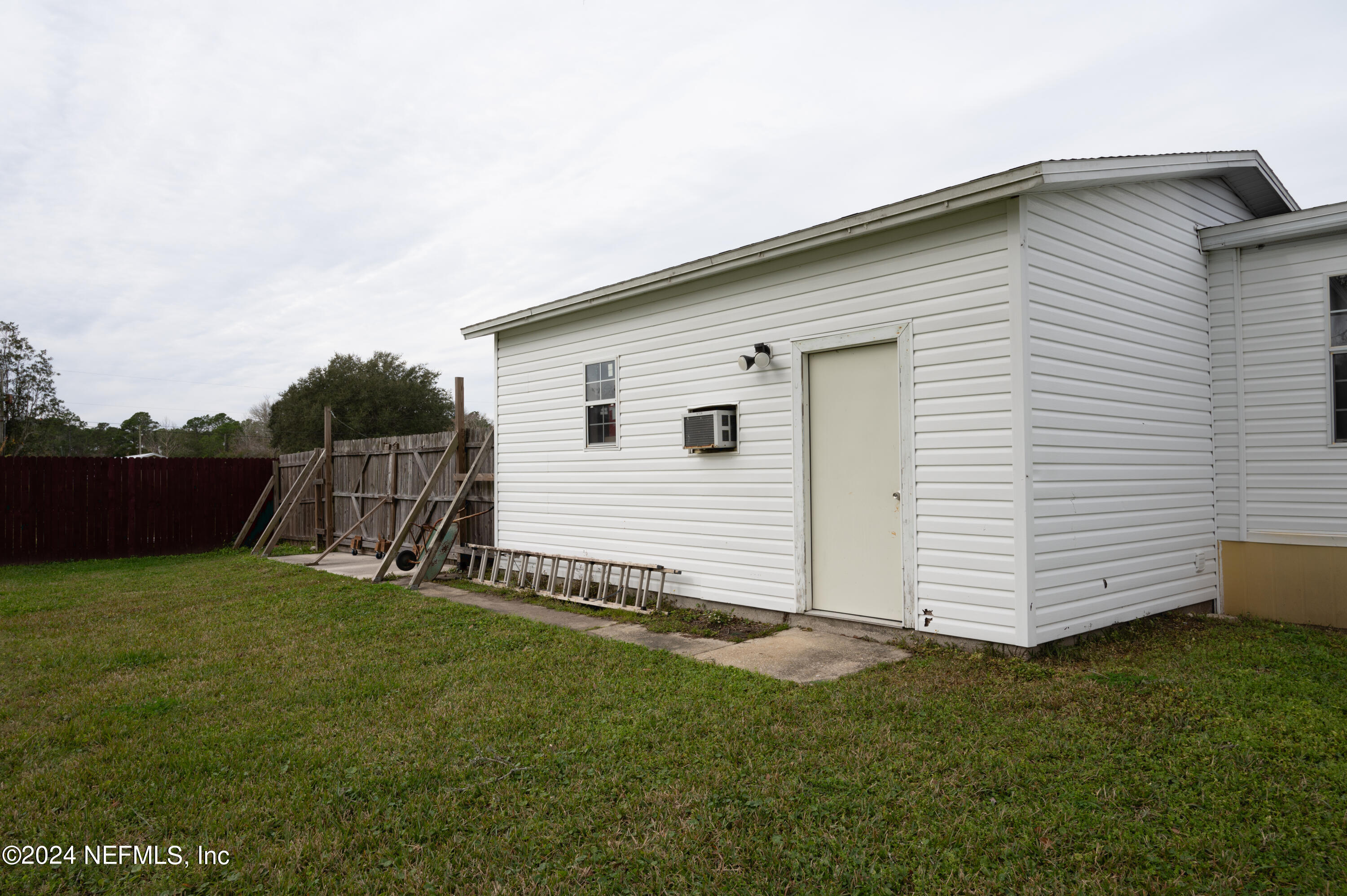 285 Dusty Road St. Augustine, FL 32095 - Photo 32 of 40 a view of a house with a yard