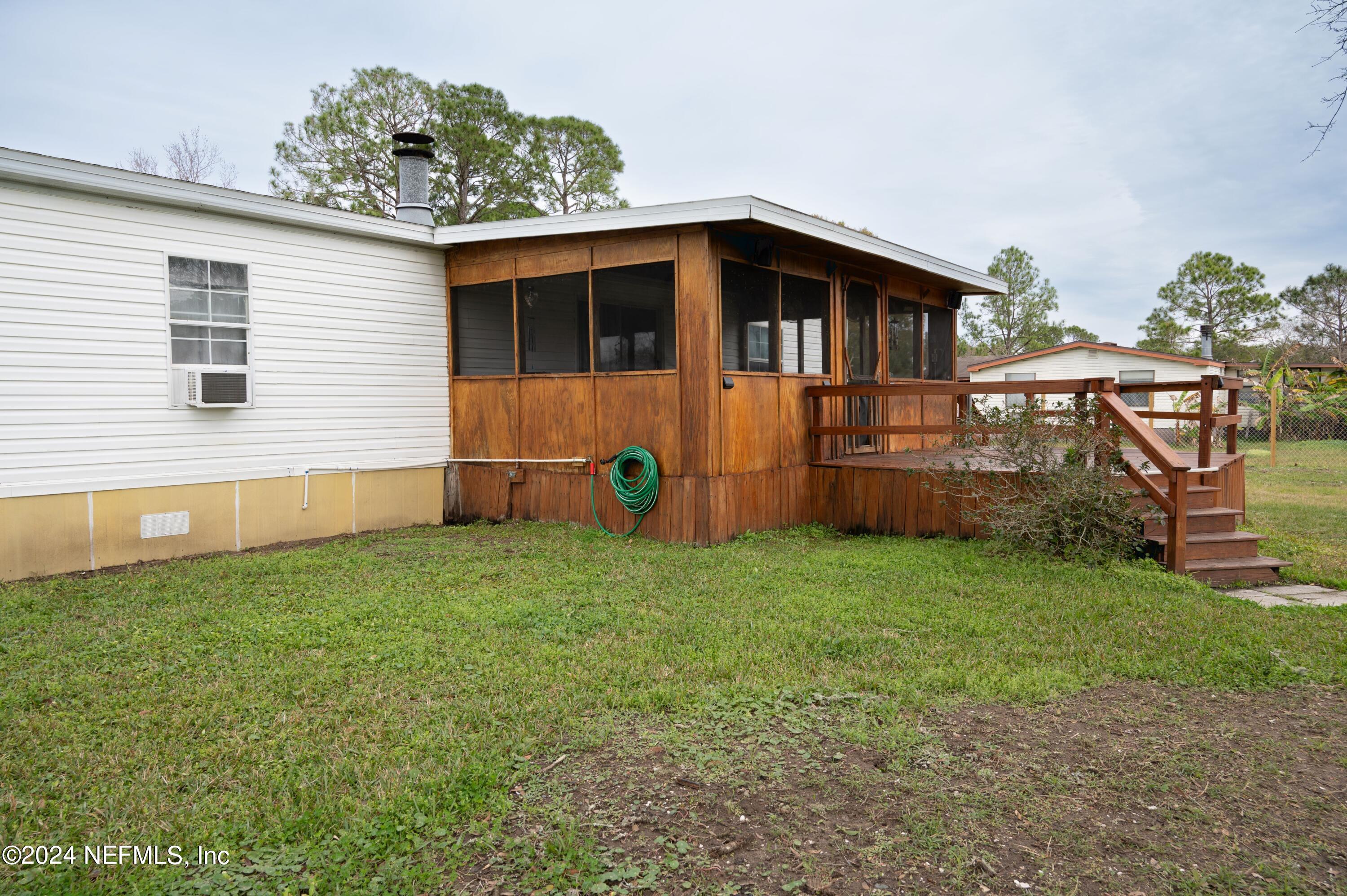 285 Dusty Road St. Augustine, FL 32095 - Photo 35 of 40 a backyard of a house with lots of green space