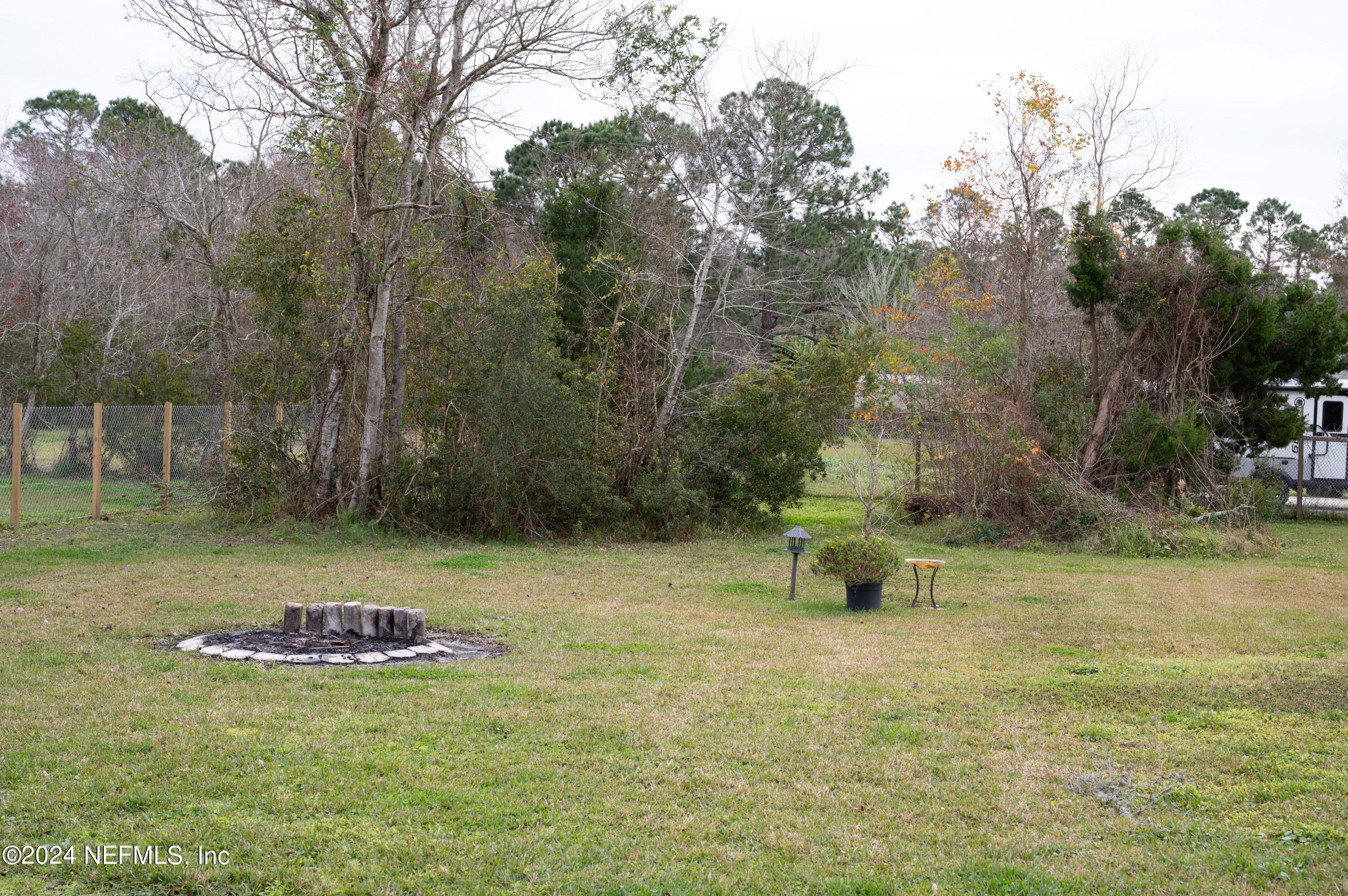 285 Dusty Road St. Augustine, FL 32095 - Photo 36 of 40 a view of a yard with a fountain