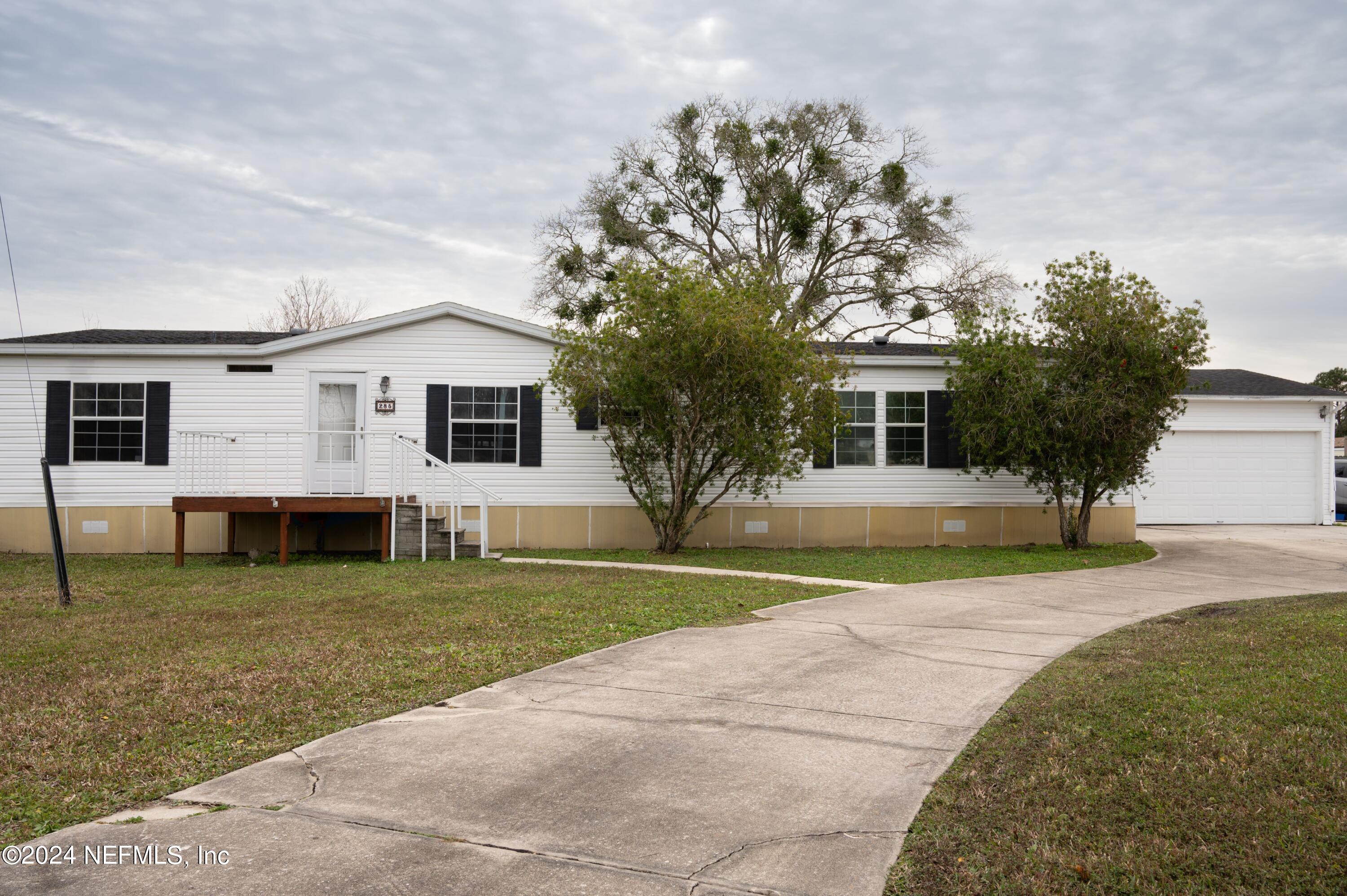 285 Dusty Road St. Augustine, FL 32095 - Photo 6 of 40 a view of a house with a outdoor space