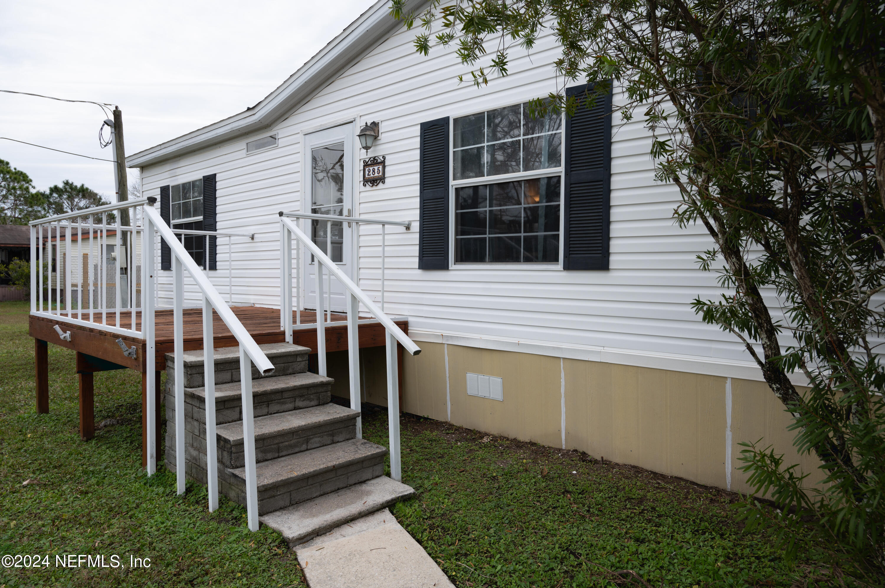 285 Dusty Road St. Augustine, FL 32095 - Photo 8 of 40 a view of a house with backyard and deck