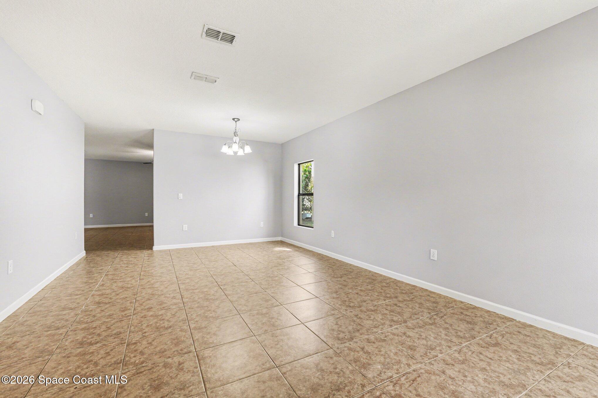 1363 Hailey Street Melbourne, FL 32904 - Photo 13 of 41 a view of an empty room and window