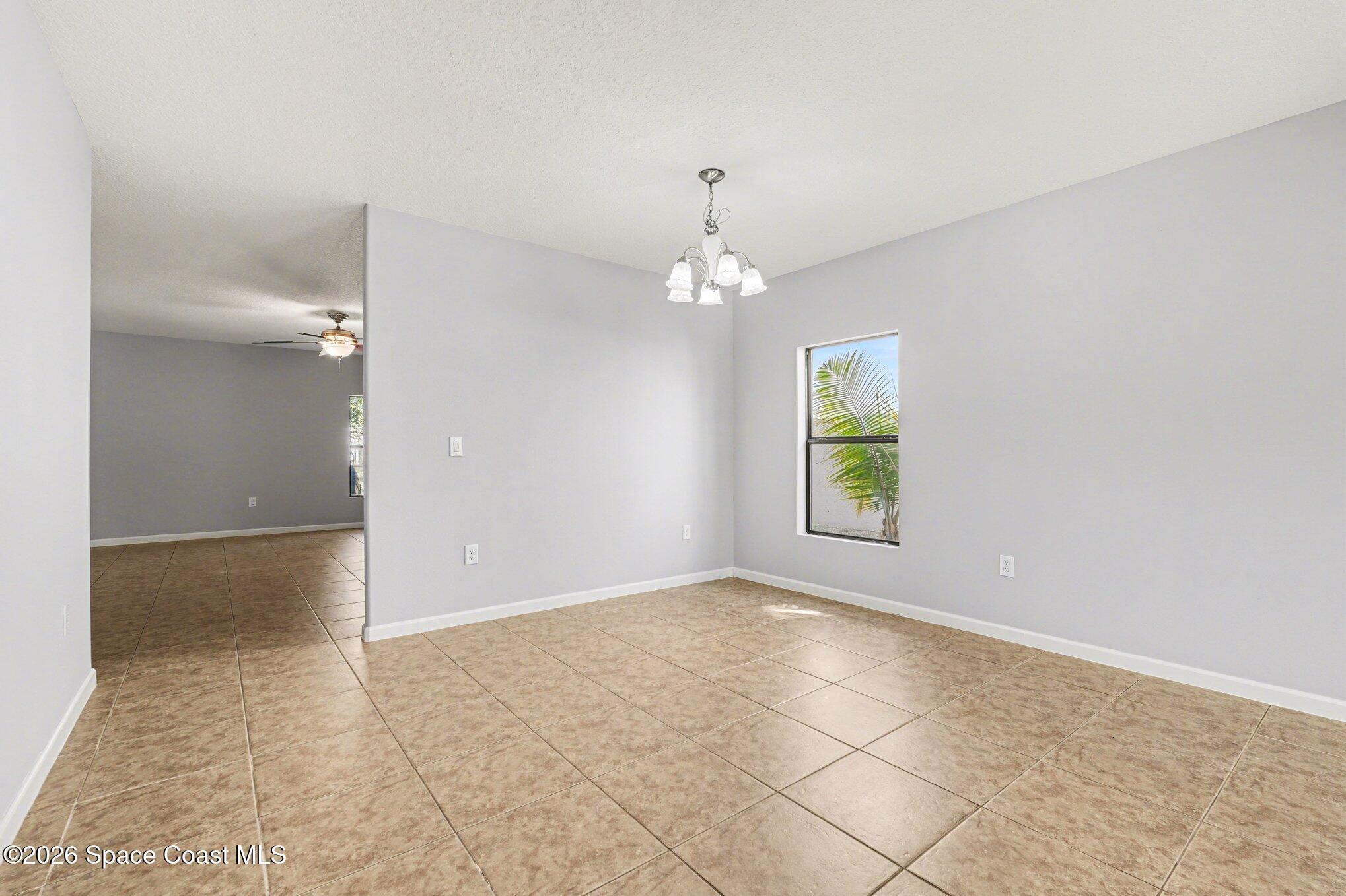 1363 Hailey Street Melbourne, FL 32904 - Photo 14 of 41 an empty room with windows and entrance