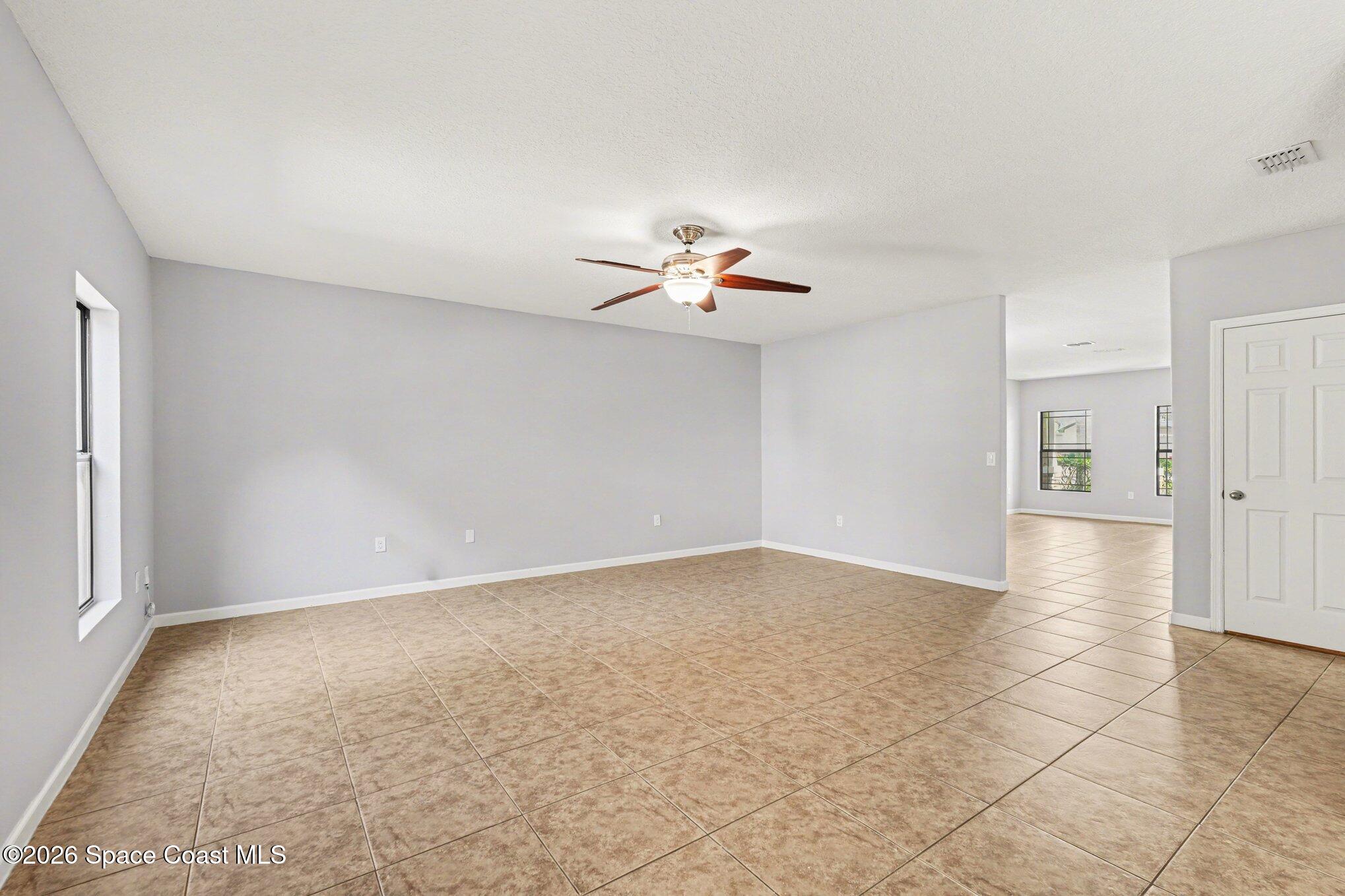 1363 Hailey Street Melbourne, FL 32904 - Photo 21 of 41 wooden floor in an empty room with a window