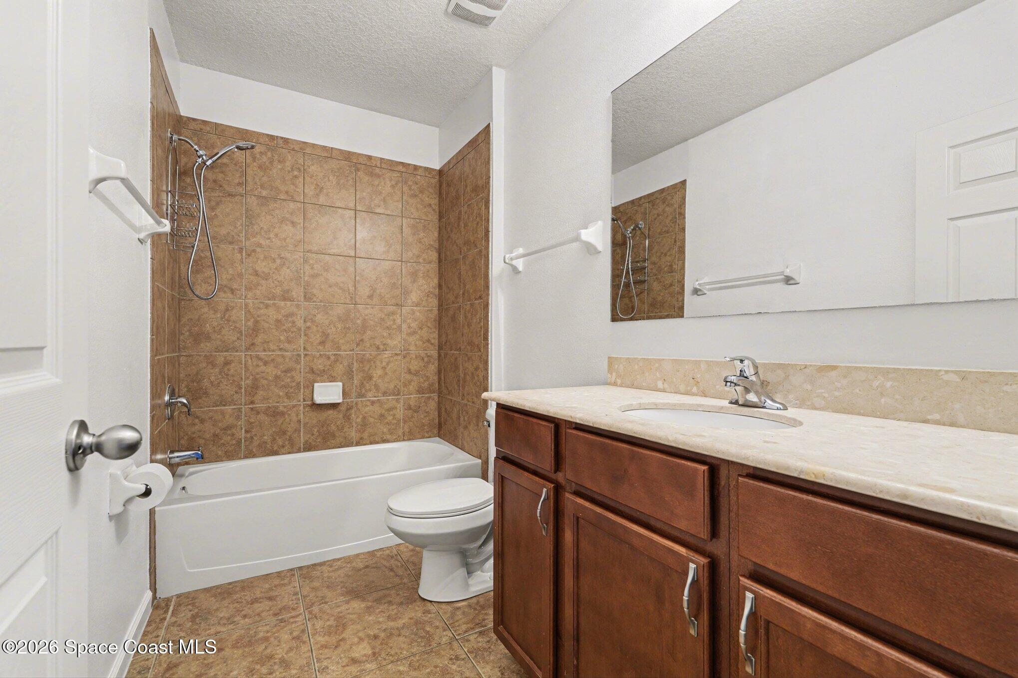 1363 Hailey Street Melbourne, FL 32904 - Photo 22 of 41 a bathroom with a sink a toilet and bathtub