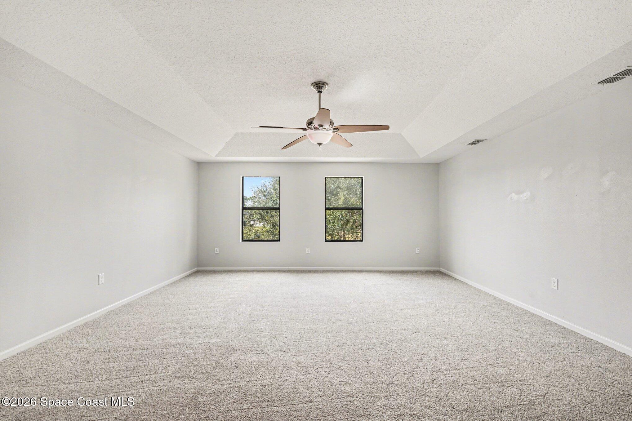 1363 Hailey Street Melbourne, FL 32904 - Photo 28 of 41 a view of an empty room with windows