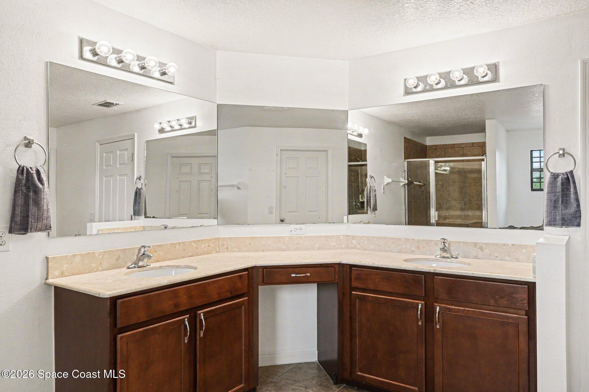 1363 Hailey Street Melbourne, FL 32904 - Photo 29 of 41 a bathroom with a sink and a mirror