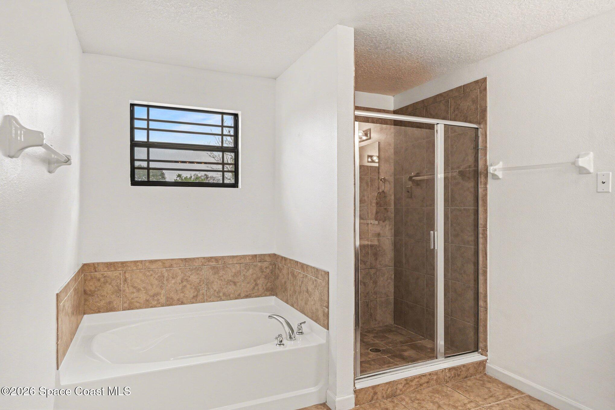 1363 Hailey Street Melbourne, FL 32904 - Photo 32 of 41 a bathroom with a bathtub and shower