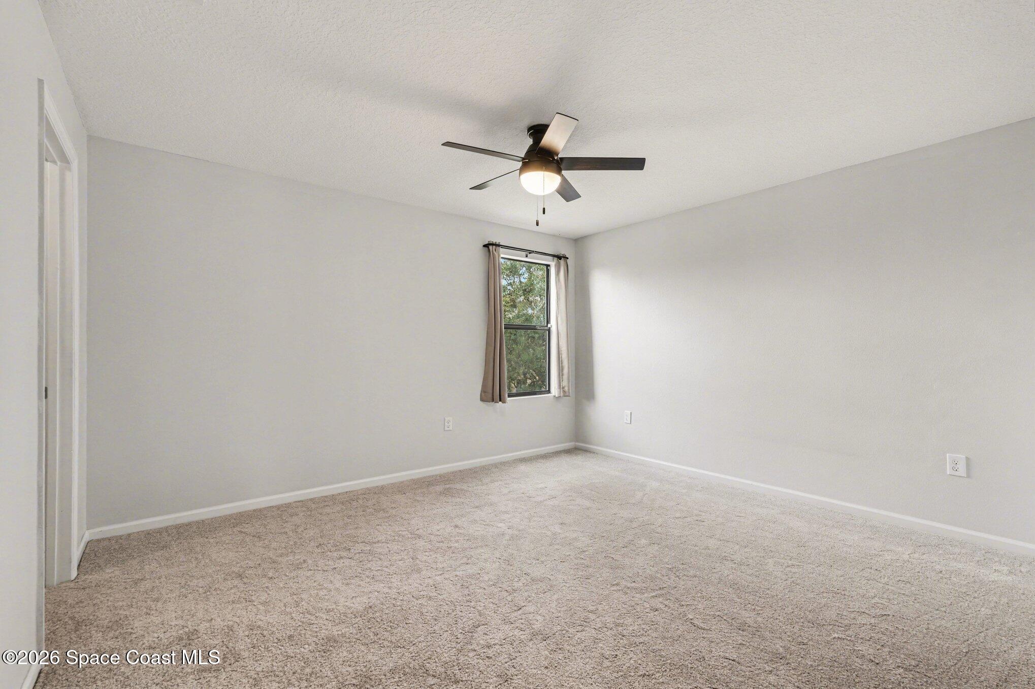 1363 Hailey Street Melbourne, FL 32904 - Photo 35 of 41 a view of an empty room with a window
