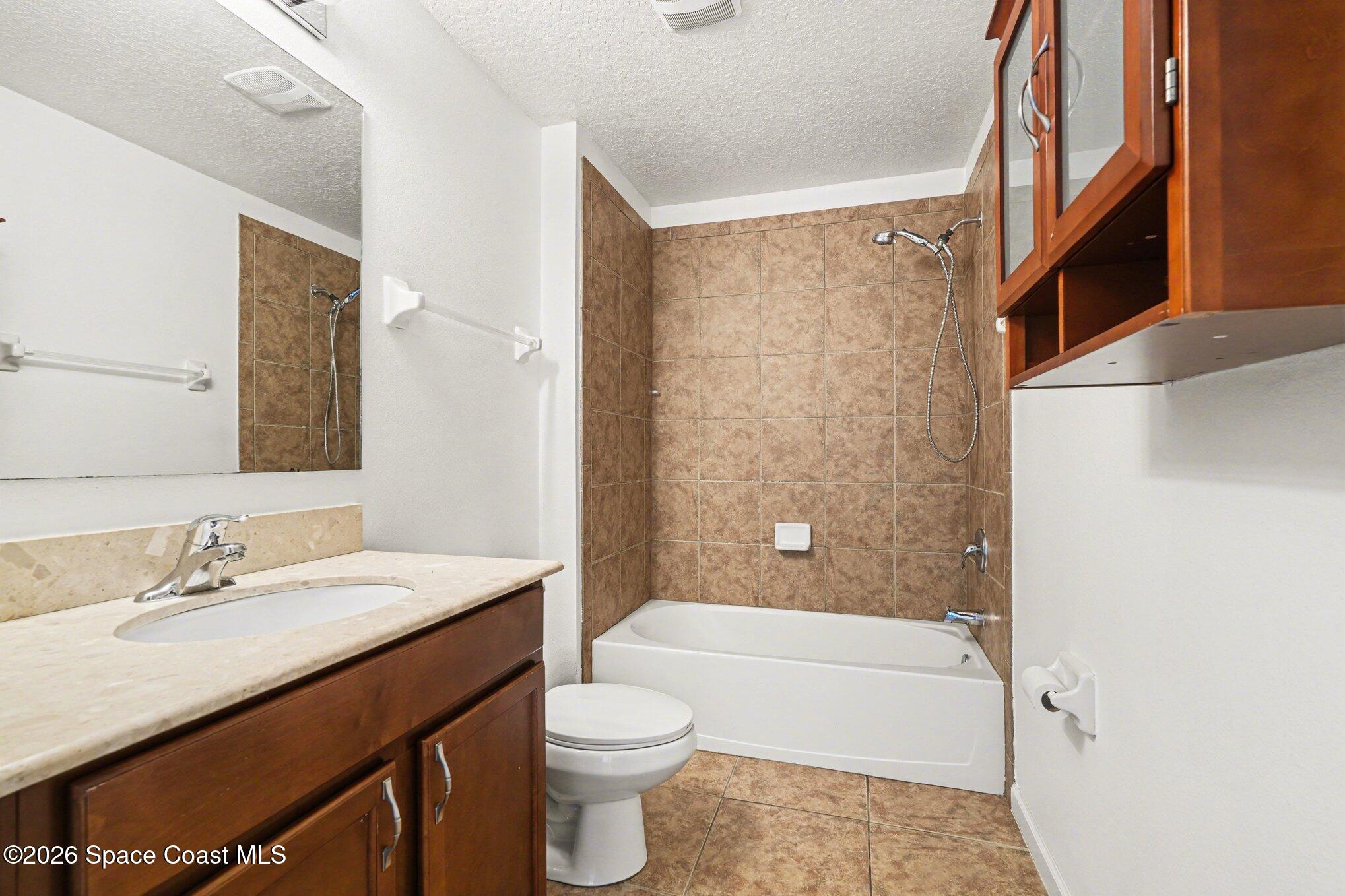 1363 Hailey Street Melbourne, FL 32904 - Photo 36 of 41 a bathroom with a sink a toilet and shower