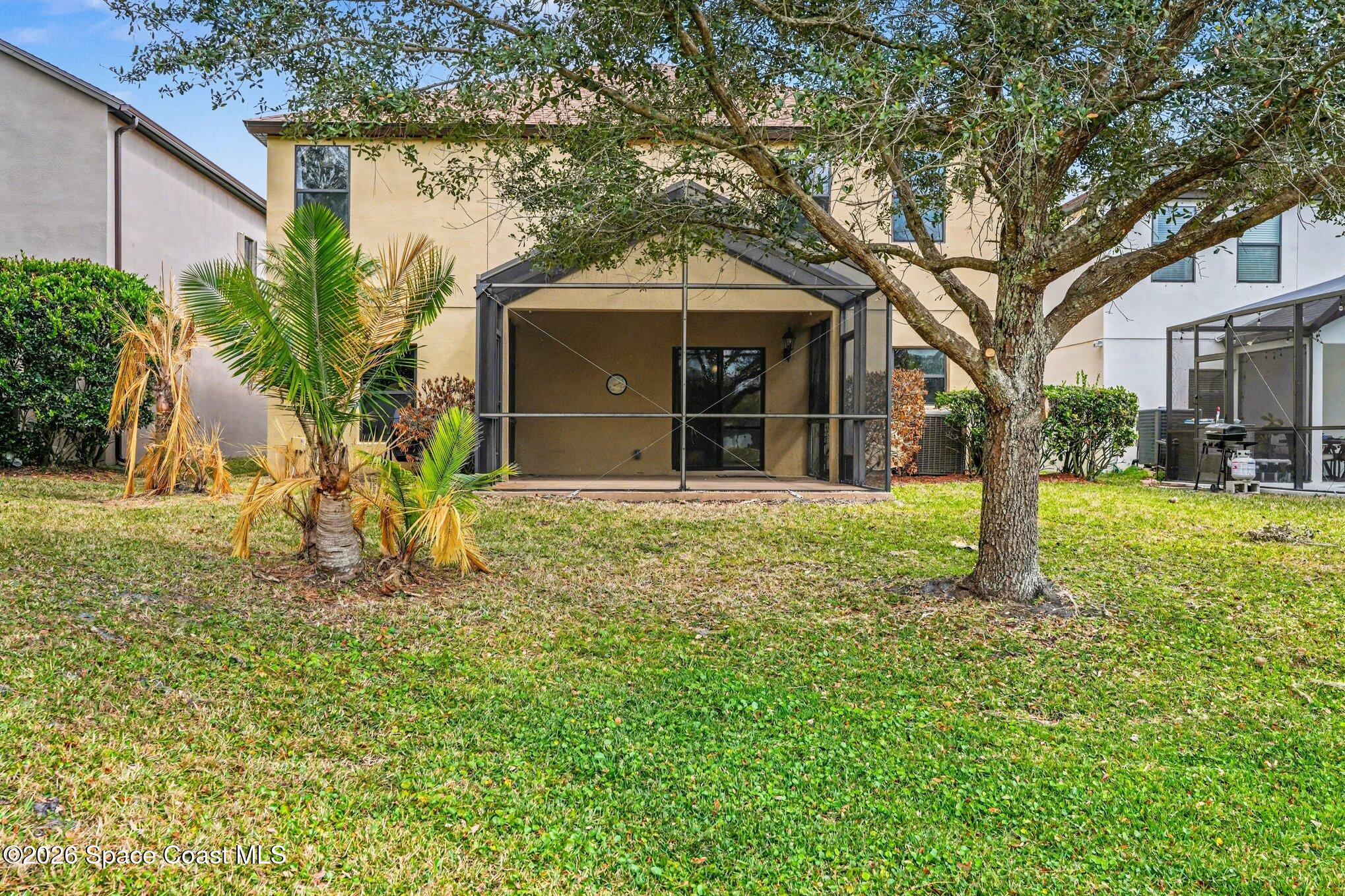 1363 Hailey Street Melbourne, FL 32904 - Photo 7 of 41 a front view of a house with garden