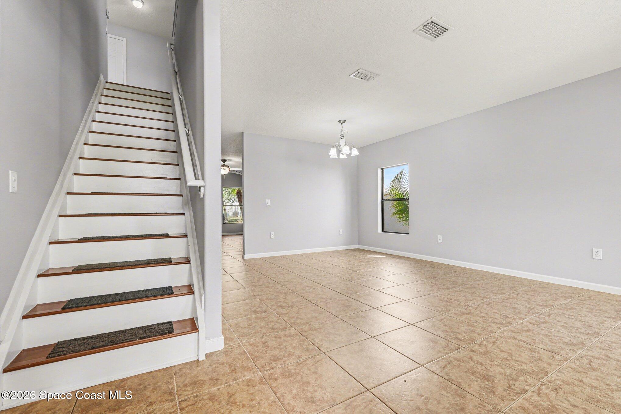 1363 Hailey Street Melbourne, FL 32904 - Photo 10 of 41 wooden floor in an empty room with a window