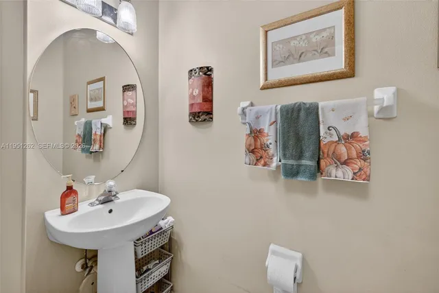 a view of a backyard with table and chairs and potted plants