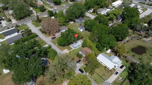 an aerial view of a house with outdoor space