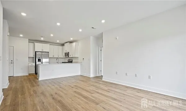 a view of kitchen with wooden floor