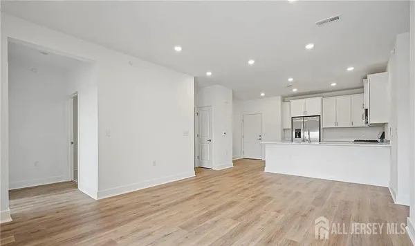 a view of kitchen with wooden floor