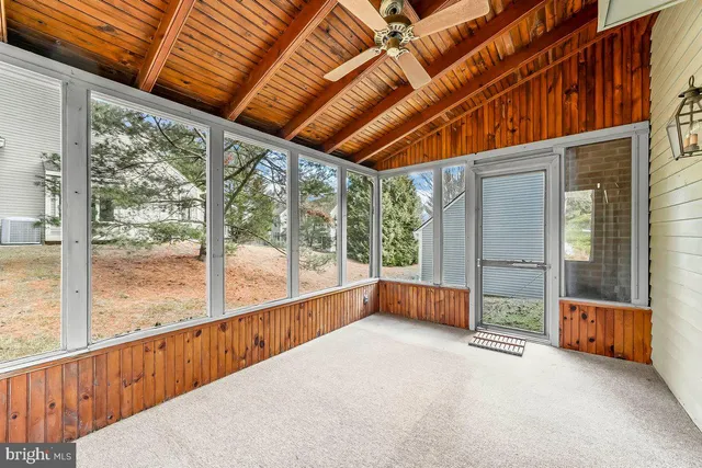 a view of an empty room with a large window