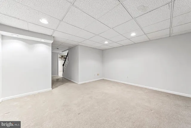 a view of empty room with wooden ceiling