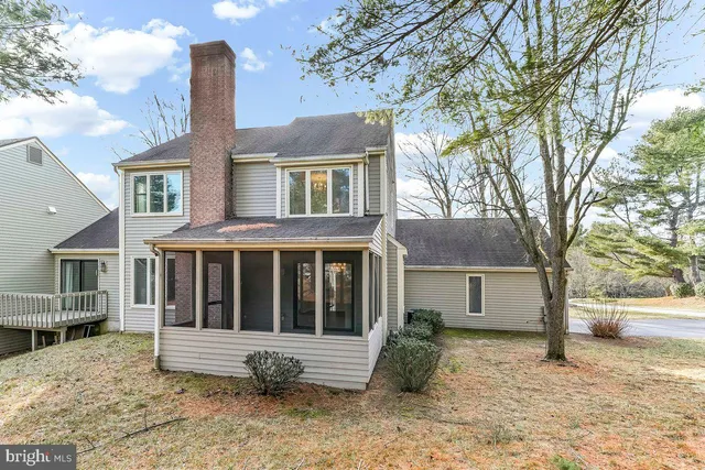 a house with trees in front of it