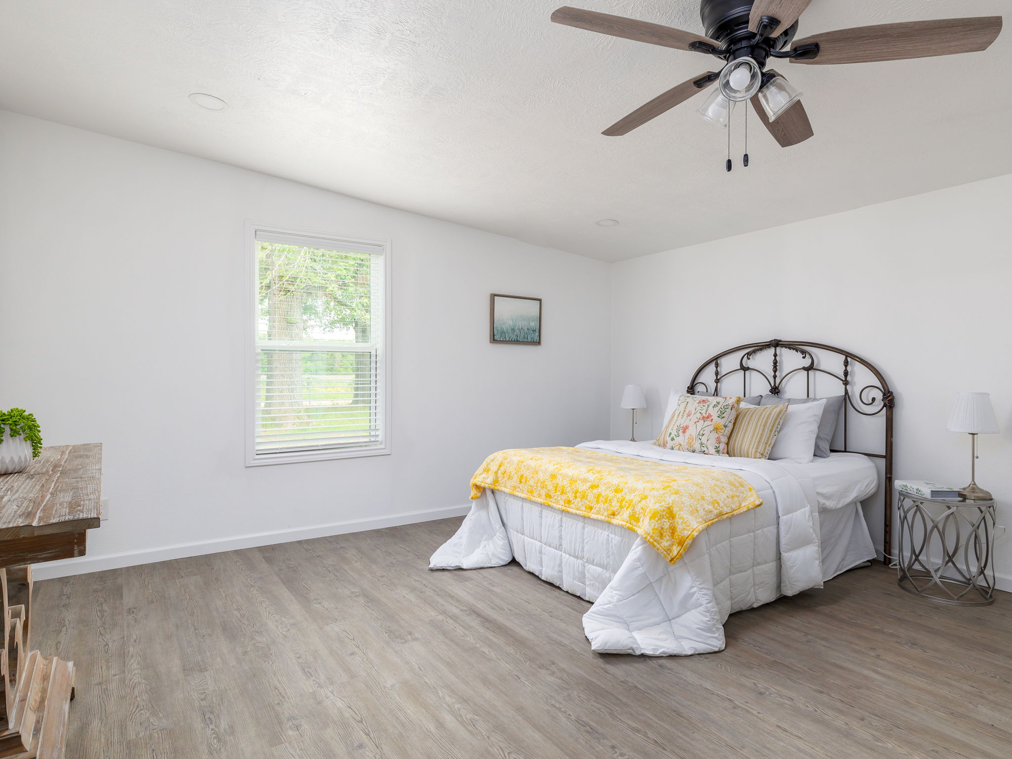 202 North Arendell Gause, TX 77857 - Photo 10 of 30 a bedroom with a bed and a chandelier