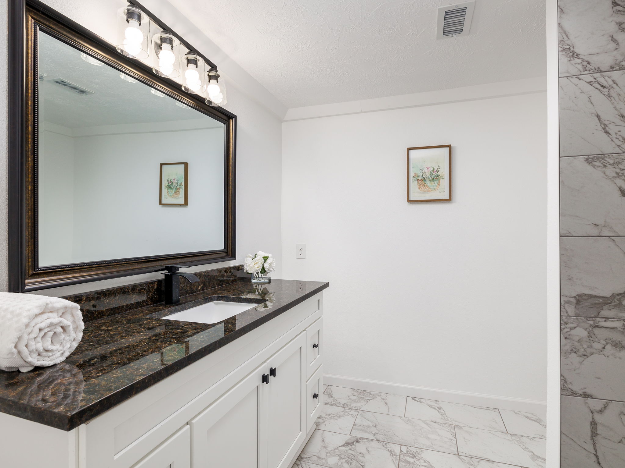 202 North Arendell Gause, TX 77857 - Photo 13 of 30 a bathroom with a granite countertop sink and a mirror