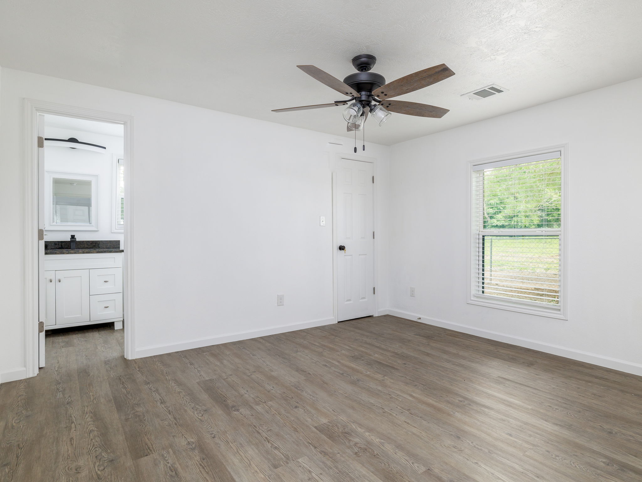 202 North Arendell Gause, TX 77857 - Photo 17 of 30 wooden floor in an empty room with a window