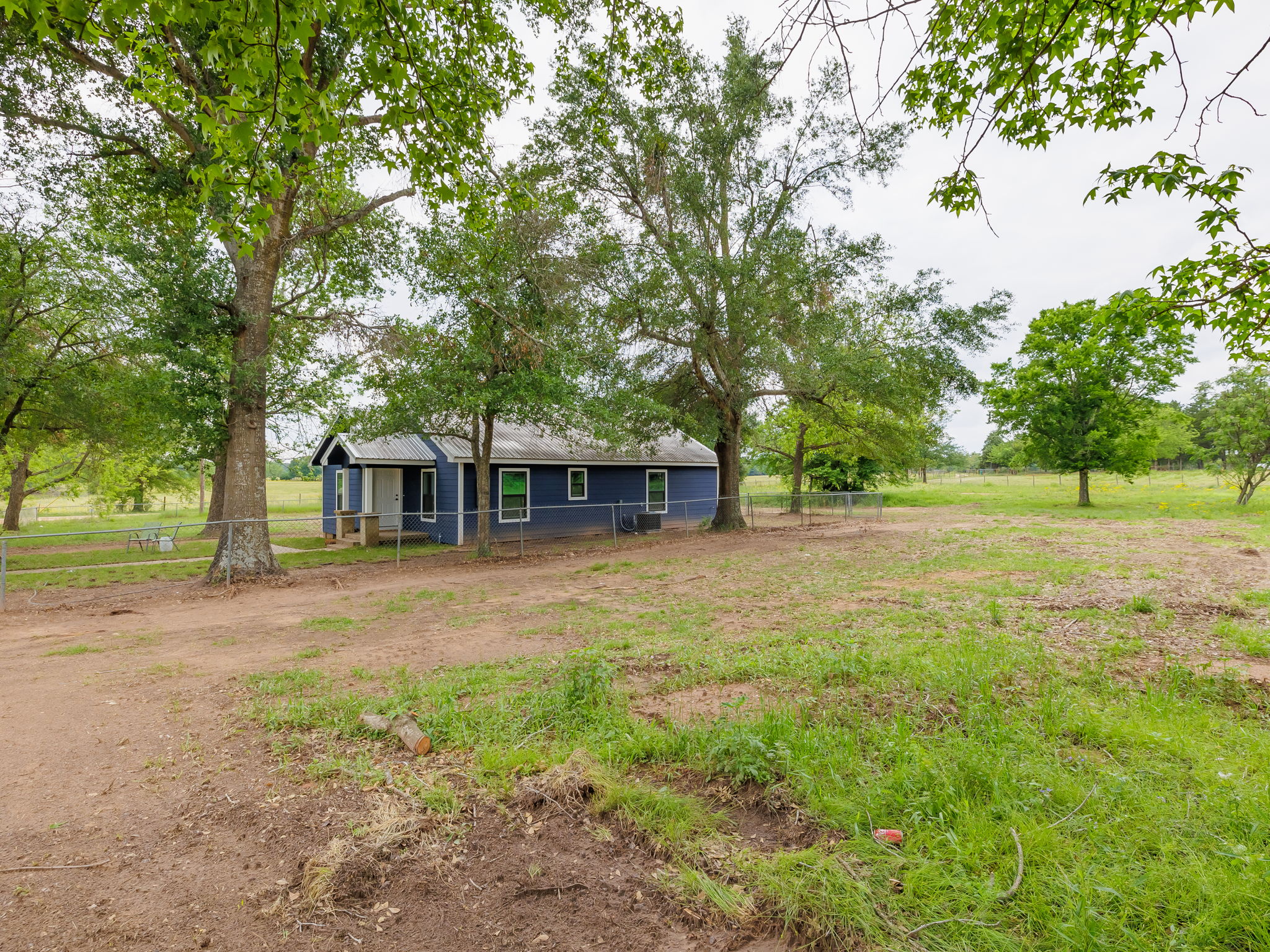 202 North Arendell Gause, TX 77857 - Photo 22 of 30 a front view of a house with a yard and trees