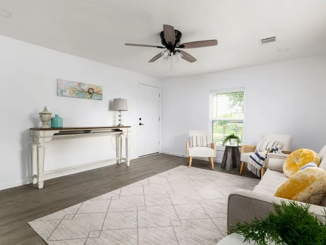 a living room with furniture and a window