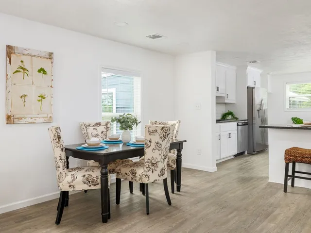 a dining room with furniture and window
