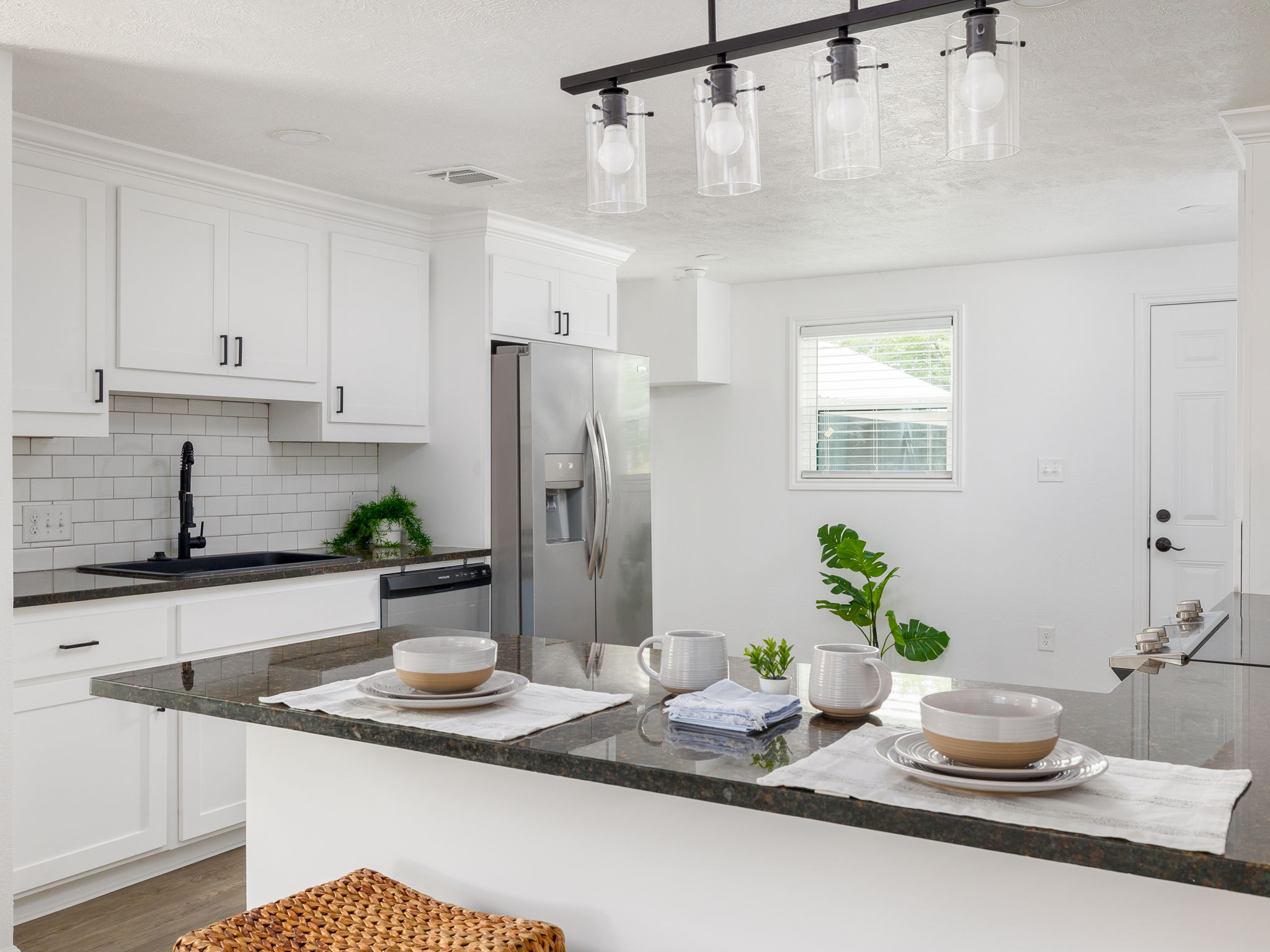 202 North Arendell Gause, TX 77857 - Photo 7 of 30 a kitchen with a refrigerator and a white cabinets