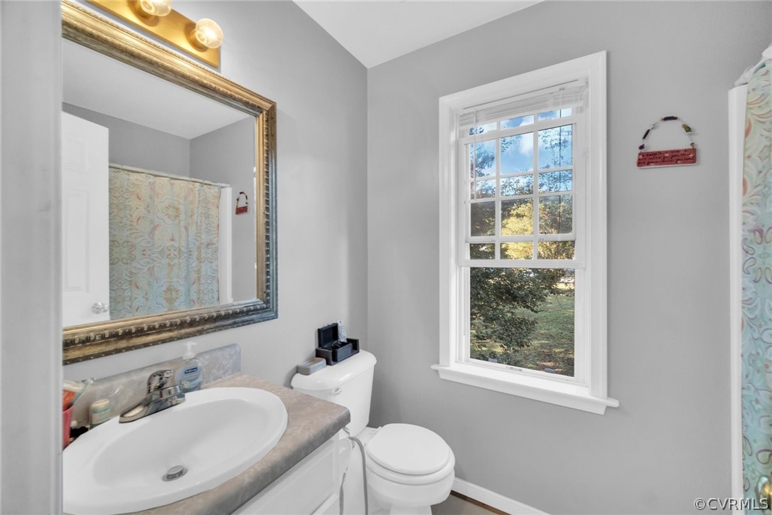 11619 Corte Castle Road Chesterfield, VA 23838 - Photo 12 of 18 a bathroom with a sink toilet and a mirror