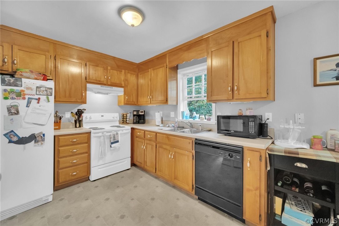 11619 Corte Castle Road Chesterfield, VA 23838 - Photo 7 of 18 a kitchen with granite countertop a sink stainless steel appliances and cabinets