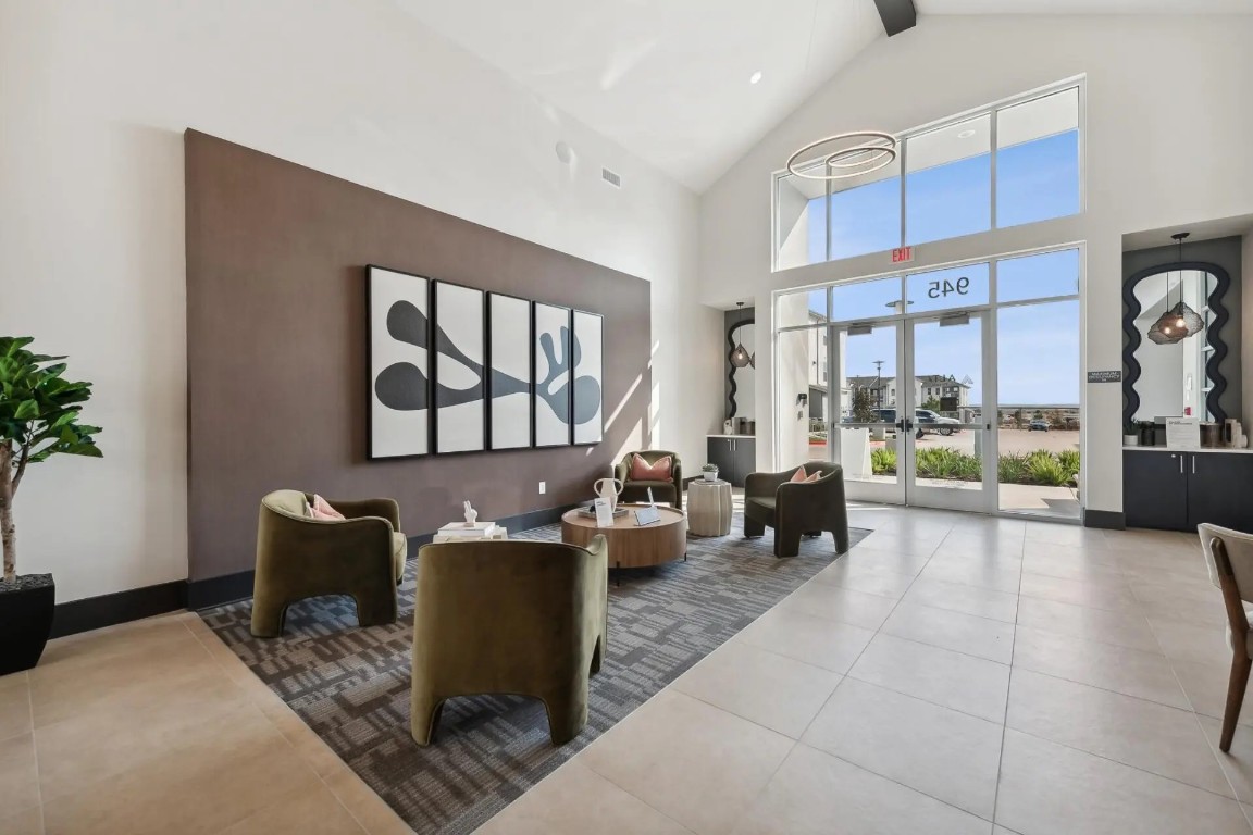 945 Blakey Lane, Unit 10304 Bastrop, TX 78602 - Photo 21 of 29 a living room with furniture large window and flat screen tv