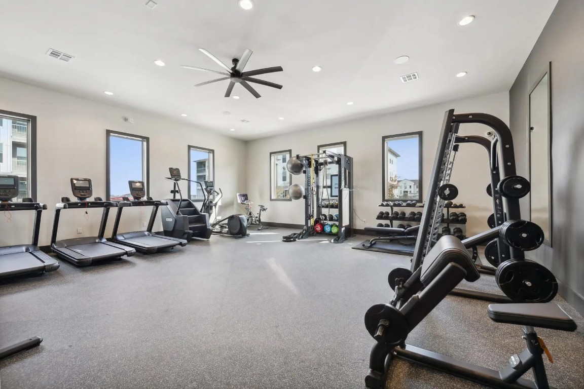 945 Blakey Lane, Unit 10304 Bastrop, TX 78602 - Photo 24 of 29 a view of a room with gym equipment
