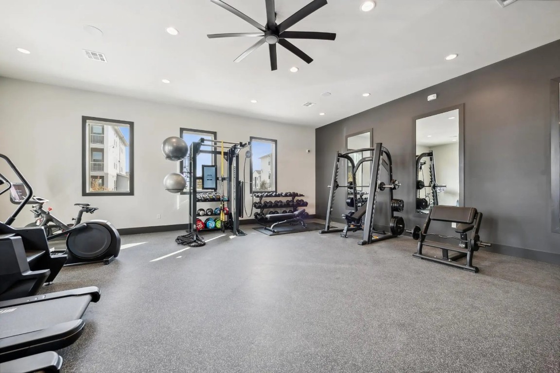 945 Blakey Lane, Unit 10304 Bastrop, TX 78602 - Photo 25 of 29 a view of a room with gym equipment