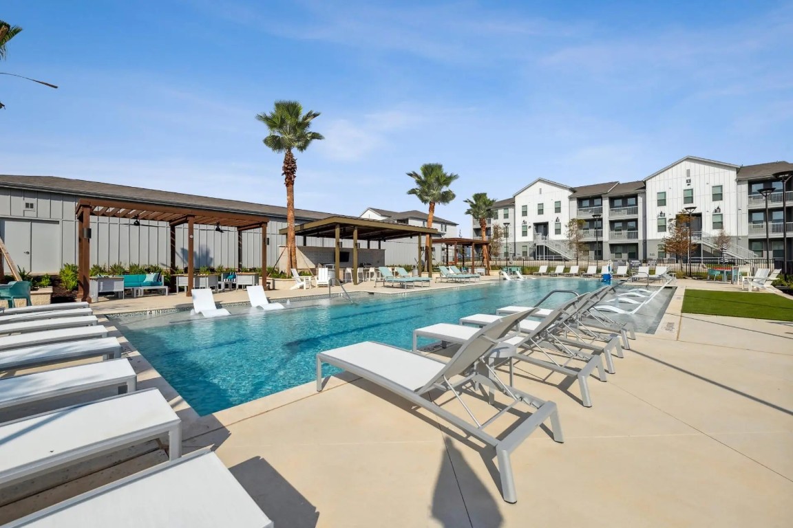 945 Blakey Lane, Unit 10304 Bastrop, TX 78602 - Photo 27 of 29 a view of a house with a yard