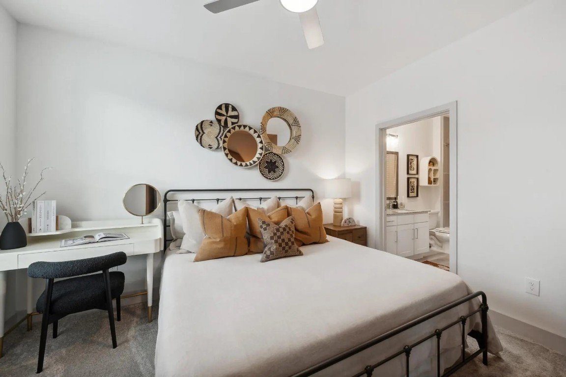 945 Blakey Lane, Unit 10304 Bastrop, TX 78602 - Photo 4 of 29 a bedroom with a bed and a table