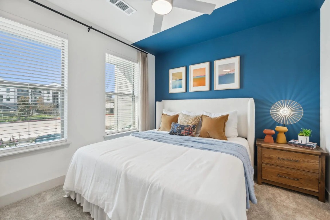 945 Blakey Lane, Unit 10304 Bastrop, TX 78602 - Photo 5 of 29 a bedroom with a bed and a window