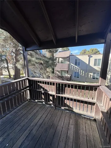 a view of balcony with wooden floor